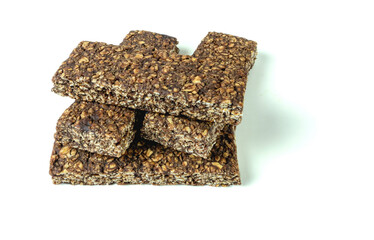 Oatmeal bars with cocoa on a white background