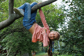 Child, monkey bars and energy on playground, smiling and obstacle course on outdoor adventure at...