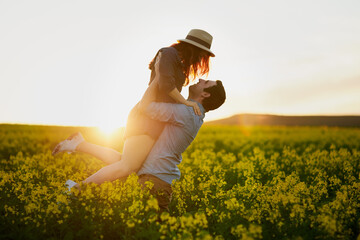 Man, lift and woman with sunset for love in nature, care and bonding for memory on field in...
