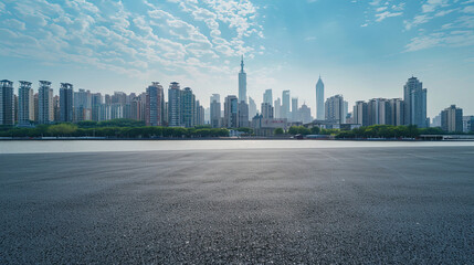 Empty asphalt road and modern city skyline with building