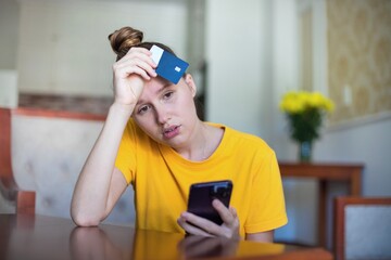 Internet fraud. Nervous sad upset unhappy confused young woman, stressed worried lady having...
