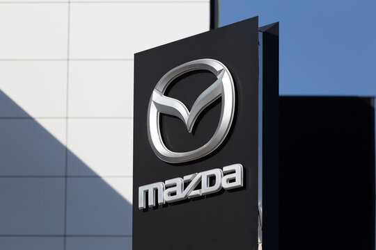 Mazda logo outside a dealership of the Japanese car manufacturer