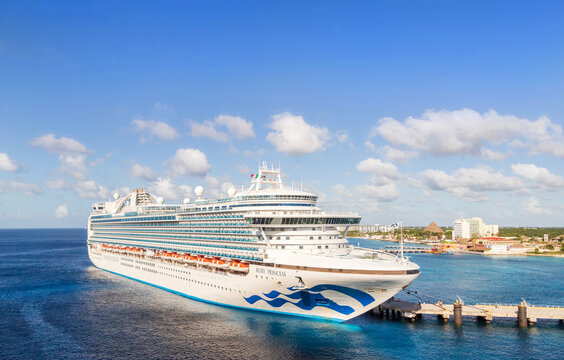 Cozumel, Mexico - January 24, 2023: Princess Cruise Lines, ship Ruby Princess docked on sunset in the port  on sunny morning of Cozumel. The island is a popular Caribbean cruise destination