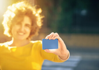 Woman, travel and card in hand for bus in city with transportation, info and mockup outdoor....