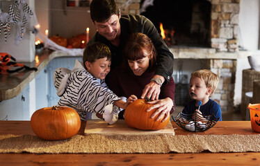 Happy family, house and children with pumpkin for halloween to celebrate with siblings, parents or...
