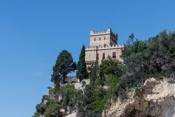 Finale ligure san donato bay and castelletto against blue sky, italy