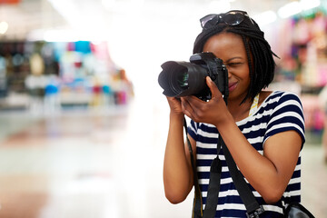 Camera, photographer or black woman in mall on holiday vacation trip for creativity, shooting or...