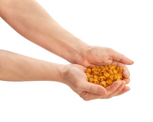 Fototapeta premium yellow raisins in hand path isolated on white