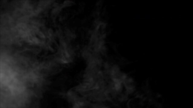 This stock motion graphics video shows light smoke billowing on a transparent background.