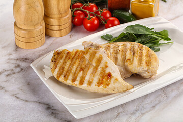 Grilled chicken breast served arugula