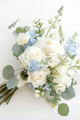 Small bouquet with white and light blue flowers on white background