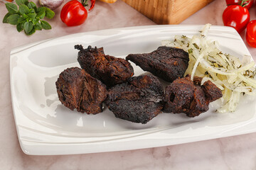 Grilled beef barbecue served onion