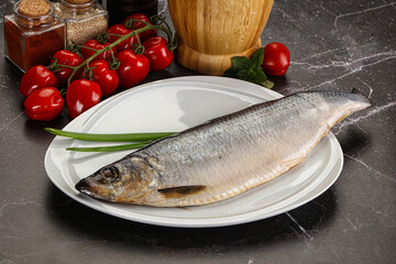 Whole raw salted herring fish