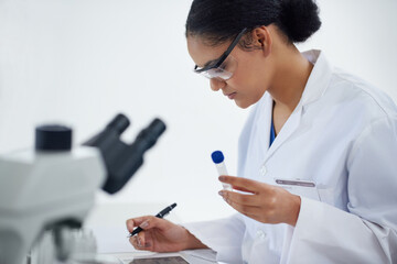 Scientist, test tube and woman with notes for research, analysis or innovation on tablet in...
