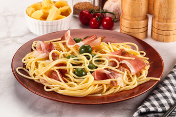 Pasta spaghetti with olives and jamon