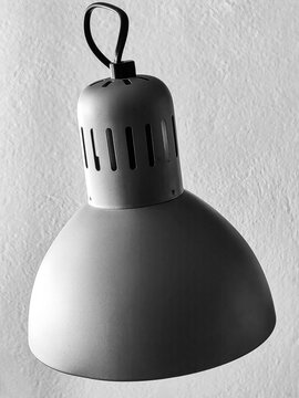 Illuminating the Unknown. The Lamp Post UFO Phenomenon Against a White Wall. Black and white, monochrome.