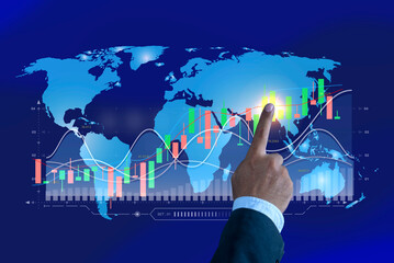 Businessman touching graph with his finger on screen with world map background. Futuristic...