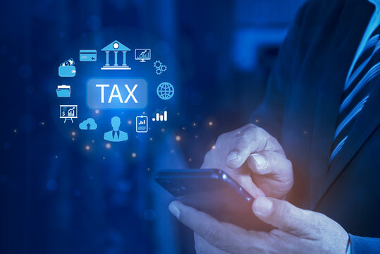 E-tax concept. Businessman show TAX for Individual income tax return form online for tax payment. Government, state taxes. Data analysis, paperwork, financial research, report.