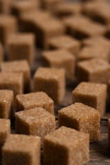 Cubes of refined cane sugar in closeup.