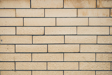 Abstract weathered texture of a brick wall, rough blocks of masonry. With space to copy. High quality photo