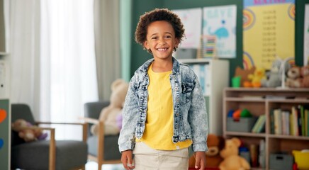 Smile, face and kid in classroom for education, learning and ready for morning kindergarten. Happy,...