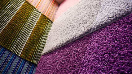 Many different carpet samples hanging on the walls
