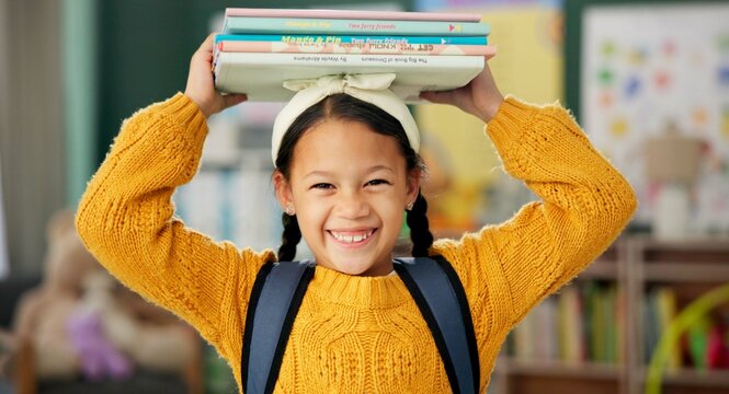 Child, face and books on head or excited for school learning or reading lesson, classroom or education. Girl, kid and portrait as youth student for academic development or knowledge, study or happy - Powered by Adobe