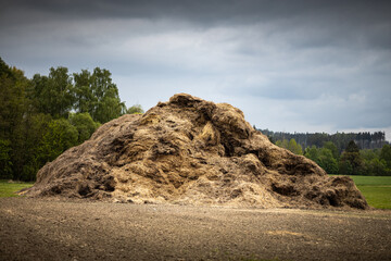 Pile of manure on field - rural scene