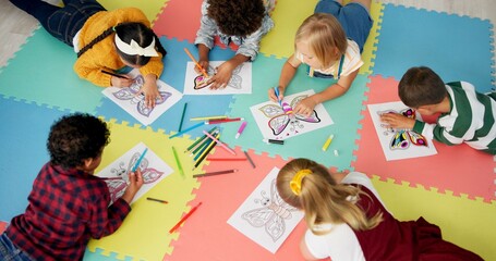 Children, group and drawing for creative learning in classroom for education, project or back to...