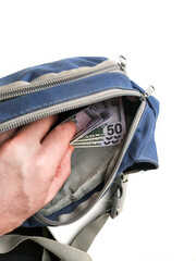 The man's hand takes out fifty dollar bills from his waist bag. white background