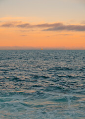 Fototapeta premium Orange Sky Sunset Over Blue Ocean