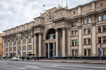 Obraz premium Central Post Office Building in Minsk, Belarus, neoclassical building with columns, sculptures and a clock.