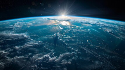 A high-resolution image of Earth from space, showing its vibrant blue oceans and green landmasses against the blackness of space