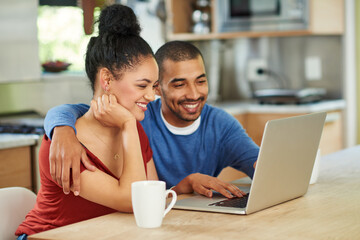 Coffee, laptop and love with couple in kitchen of home, reading information for online booking. Computer, hug or love with happy man and woman in apartment for planning, research or social media