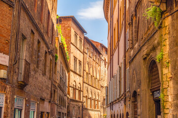 Siena, medieval town in Tuscany, with view of the Dome & Bell Tower of Siena Cathedral,  Mangia Tower and Basilica of San Domenico, Italy