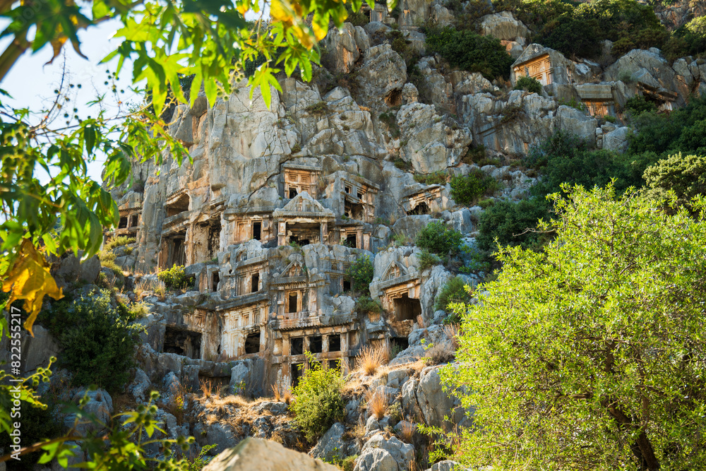 Wall mural Myra archaeological site with rock tombs in Demre, Turkey. The Ancient City of Myra is especially famous for its Lycian-Era rock tombs, Roman-Era theatre