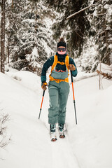 Mountaineer backcountry ski walking ski alpinist in the mountains. Ski touring in alpine landscape...