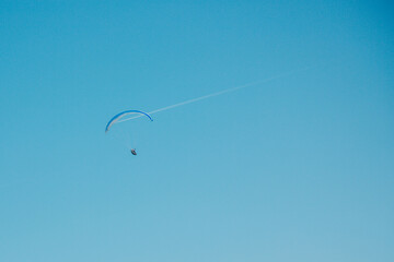 red and yellow Parachute flying above land