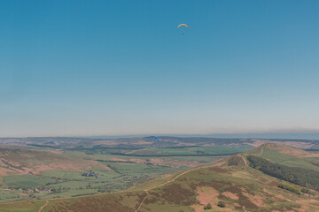 red and yellow Parachute flying above land