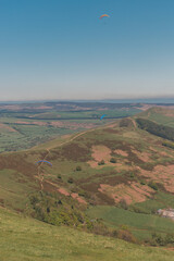 red and yellow Parachute flying above land