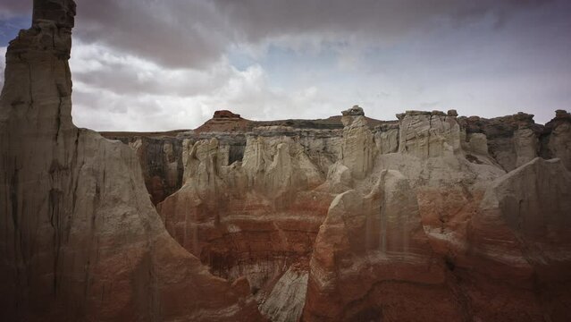 Aerial flyover view approaching Painted Desert rock formations / Tuba City, Arizona, United States