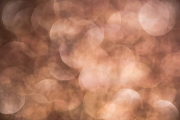Blurred copper bokeh abstract background.use as backdrop for holiday or anniversary occasion celebration.