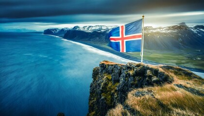 The Icelandic flag waving triumphantly atop a cliff overlooking a vast, windswept coastline.