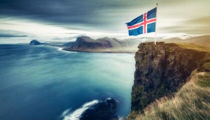 The Icelandic flag waving triumphantly atop a cliff overlooking a vast, windswept coastline.