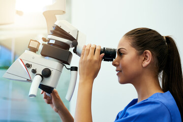 Microscope, pathology and woman with medical research of virus at hospital or science lab. Student,...