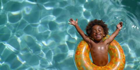 A happy african american child floats in a pool with a bright orange inflatable ring, arms raised in excitement. The clear blue water glistens in the sunlight, childhood joy.Welcoming summer.