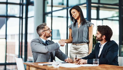 Business man, woman and handshake in boardroom with agreement, welcome and happy with contract....