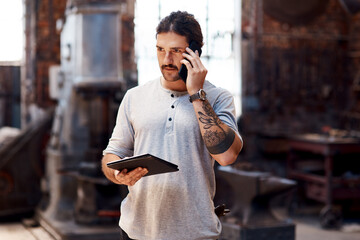 Phone call, tablet and thinking with man in workshop for communication, manufacturing or...