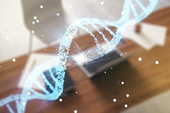 Creative concept with DNA symbol illustration and modern desktop with computer on background. Genome research concept. Multiexposure