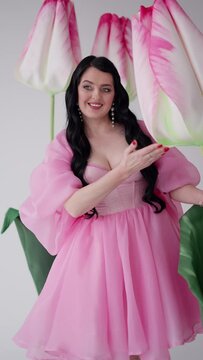 Charming human in tule pink dress. Concept of female charm.